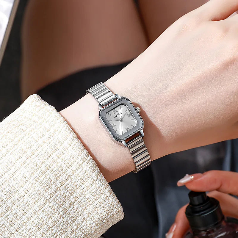 A small, exquisite and light luxury watch with a steel band for women, exuding a sense of artistic, niche and high-end style