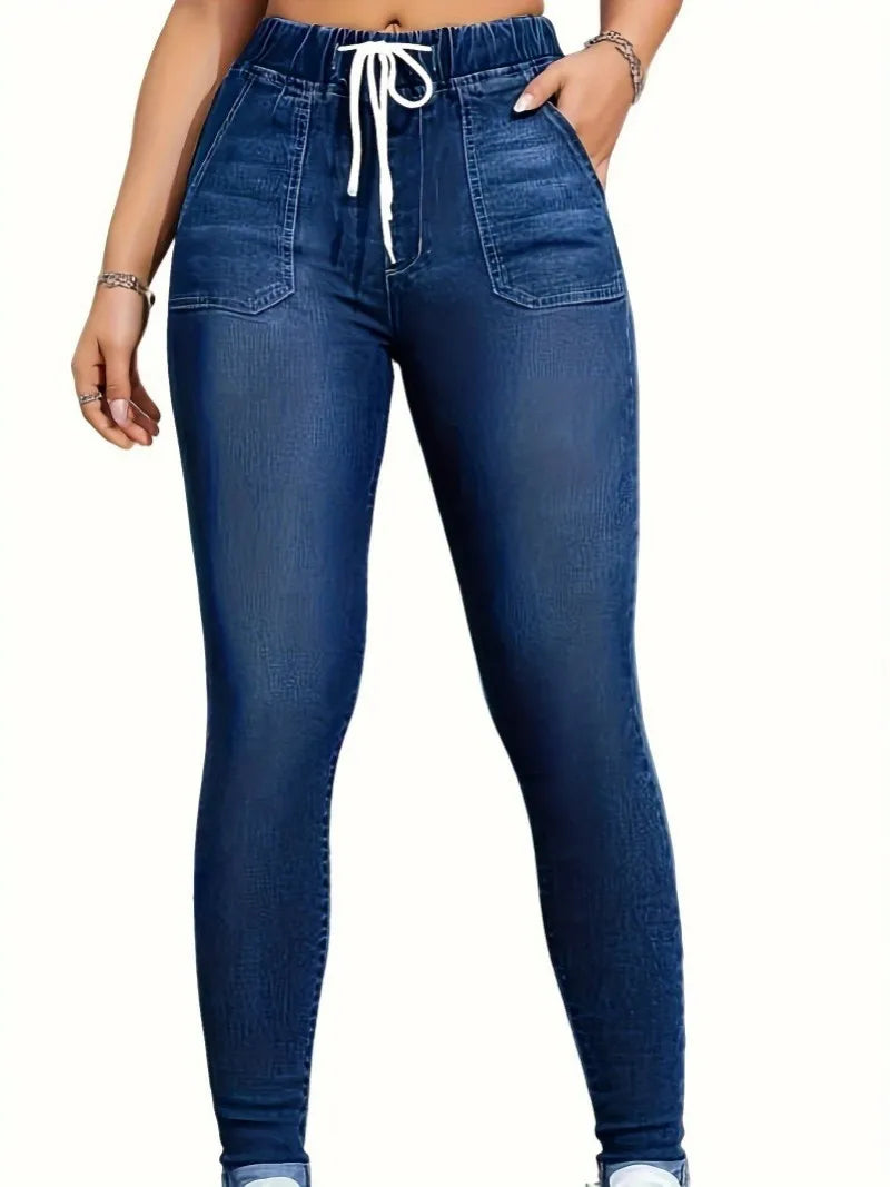 Women's high-waisted skinny jeans with drawstring waist, elastic cuffs, and slimming fit