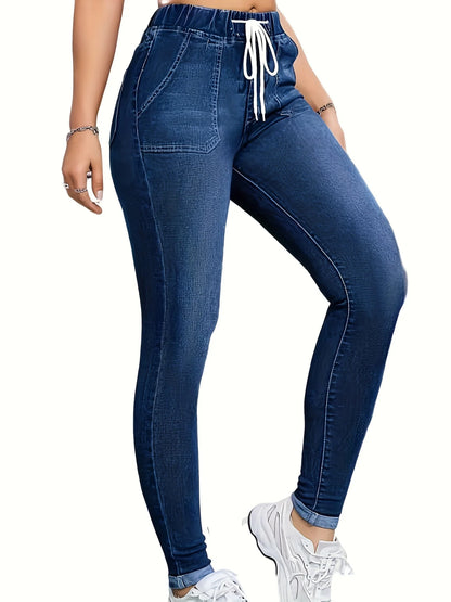 Women's high-waisted skinny jeans with drawstring waist, elastic cuffs, and slimming fit